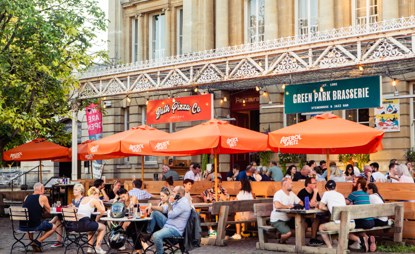 People eating, drinking and shopping in Green Park Station